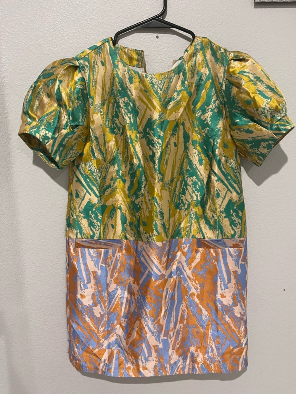 Anthropologie’s See U Soon Green and Orange Abstract Print mini Dress